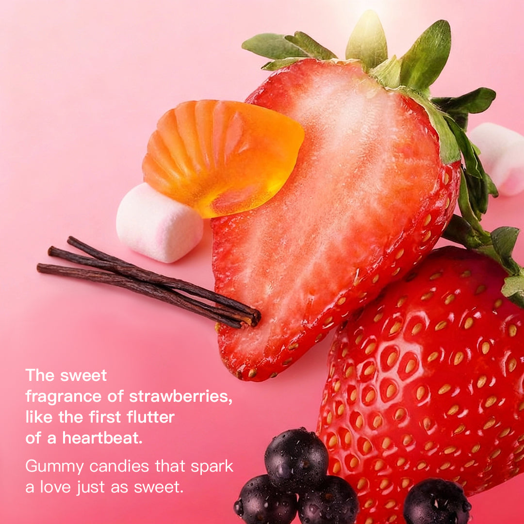 Artistic arrangement of fresh strawberries, gummy candies, and vanilla beans on a pink background, with text describing the perfume's sweet and romantic fragrance story.