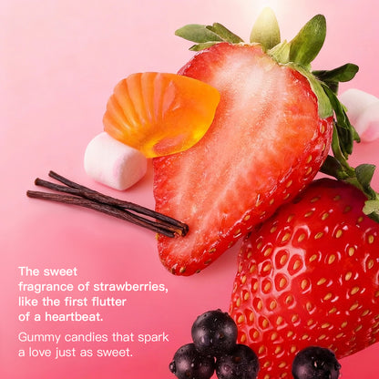 Artistic arrangement of fresh strawberries, gummy candies, and vanilla beans on a pink background, with text describing the perfume's sweet and romantic fragrance story.